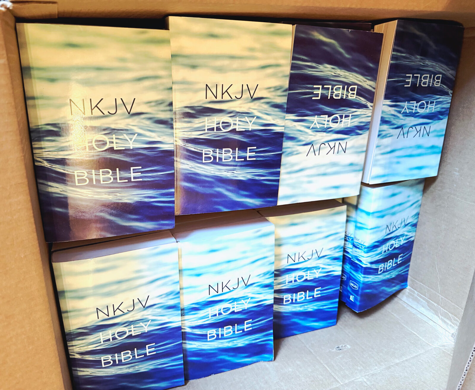 A box of NKJV Holy Bibles purchased through Go Spread donor support, packed and ready for hand-delivery in Malawi